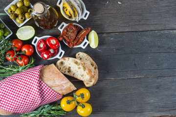Spanish tapas on wooden rustic table from above