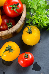 Farm fresh tomatoes with fresh basil herb and rock salt