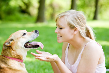 Park: Blond Woman Plays with Retriever Mix