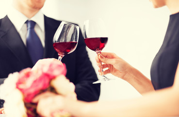 engaged couple with wine glasses