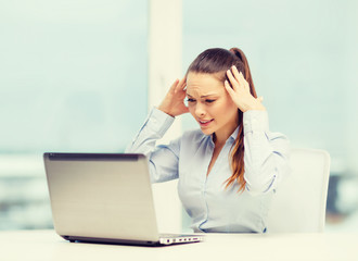 stressed woman with laptop