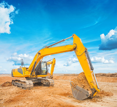 exkavator on construction site and sky background