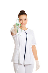 Female doctor holding up oxygen mask