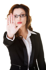 Business woman making stop sign.