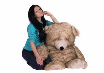 girl with big teddy bear. studio shot