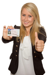 Young woman showing her driver's license - 77405055