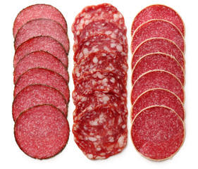 Slices of salami isolated on white