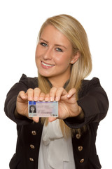 Young woman showing her driver's license - 77405680