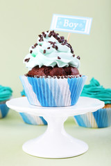 Delicious cupcake with inscription on color background