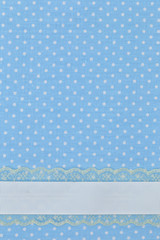 Blue retro polka dot textile background with ribbon