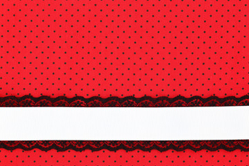 Red retro polka dot textile background with ribbon