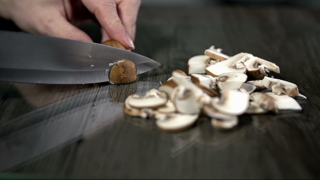 Cutting up the mushrooms in slow motion