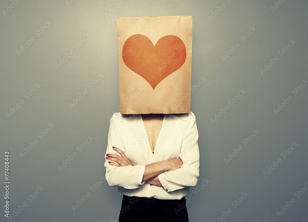 Poster woman hiding under paper bag