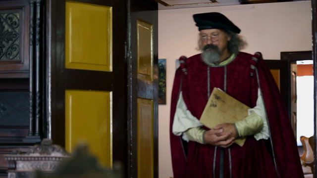 Old 19th century scholar entering the room