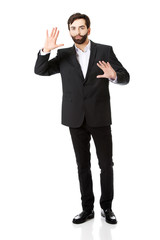 Businessman pressing abstract screen.