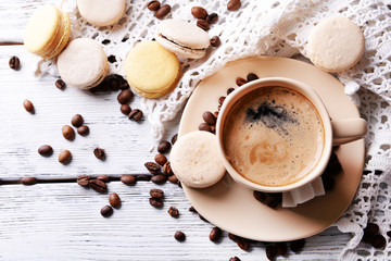 Gentle colorful macaroons and  coffee in mug