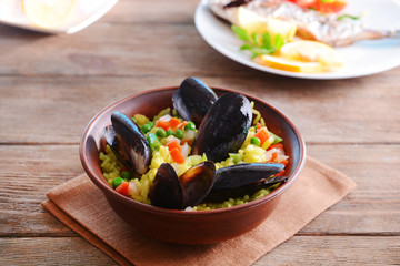 Seafood Paella on plate on table close-up