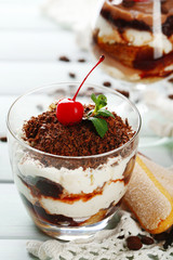 Tasty tiramisu dessert in glasses,