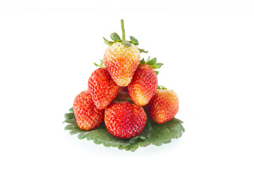 Strawberries and leafs on white background