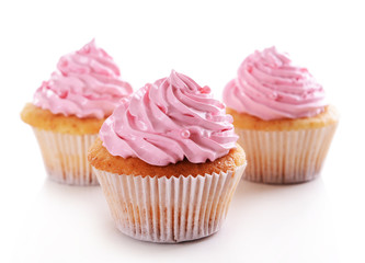 Delicious cupcakes isolated on white
