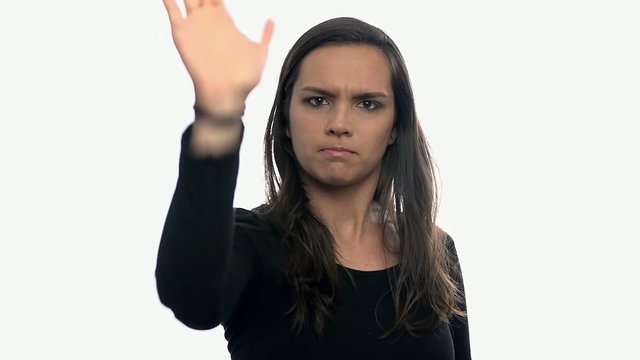 Woman showing stop with hand on white background