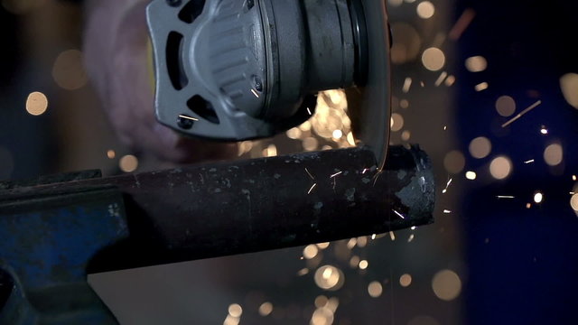 Making some cuts into the metal with electric grinder