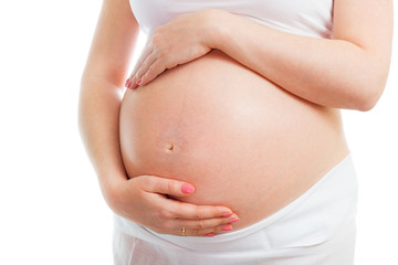 Pregnant belly isolated on white background. Healthy pregnancy concept.