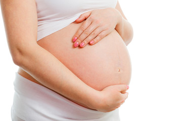 Pregnant belly isolated on white background. Healthy pregnancy concept. 