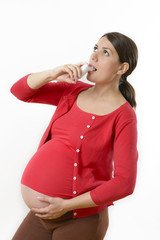 Pregnant woman using medicinal spray