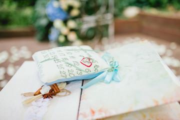 wedding rings on a pillow