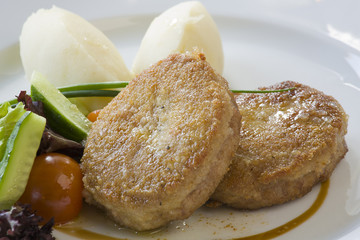 Cutlet and potatoes with vegetables