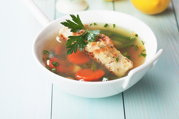 Sea food soup with cod fish steak
