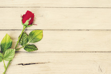 Fototapeta na wymiar Vintage,still life rose flower on wood