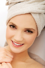 Woman relaxing in bathtub.