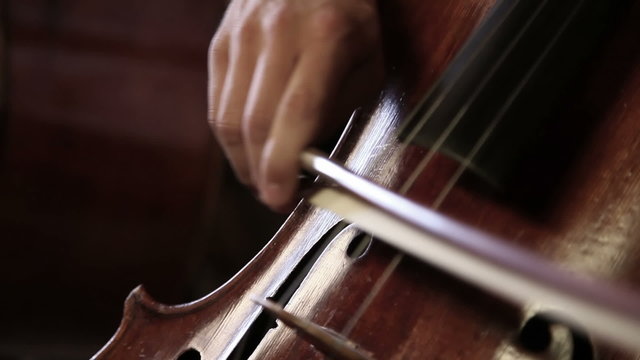 Close up pan shot of a piano player