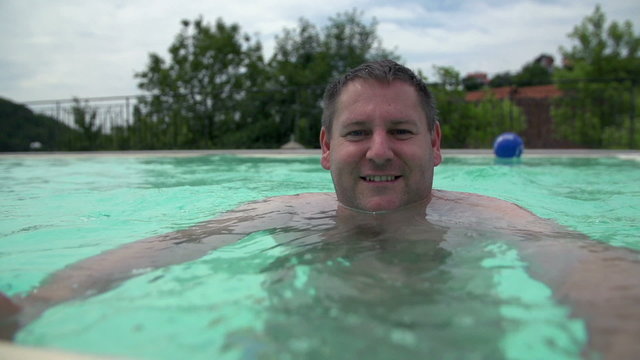 Man Enjoy Free Time In Swimming Pool