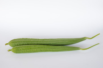 Ridge gourds on white background