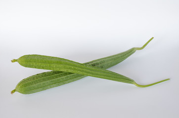 Ridge gourds on white background