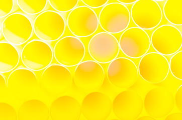 Blurred bright yellow bubbles as background.