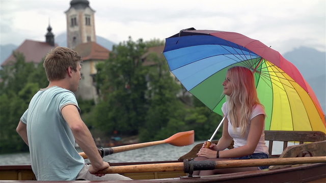 Close up young man and woman on wooden boat