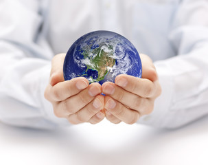 Earth in hands. Earth image provided by Nasa.