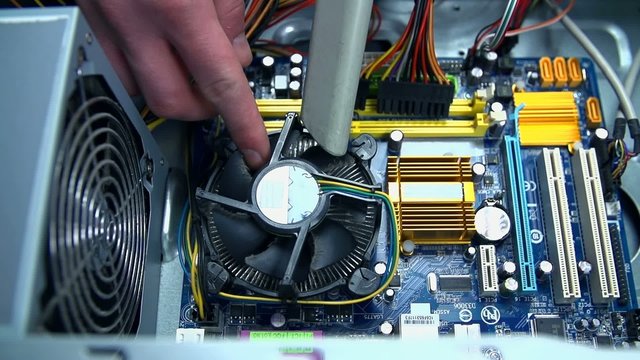 Vacuuming cooling ribs on computer processor