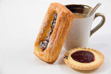 Cup of coffee and danish pastry.