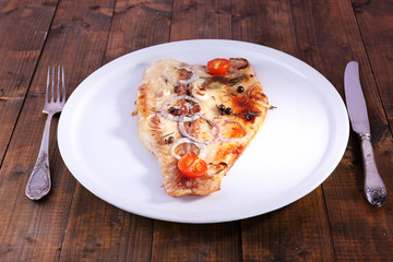 Dish of Pangasius fillet with spices and vegetables