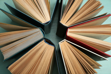 Naklejka premium Group of books on colorful background, top view