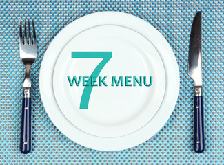 Plate with text Week Menu, fork and knife
