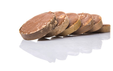 Round palm sugar over white background