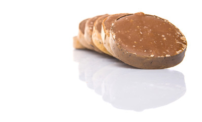 Round palm sugar over white background