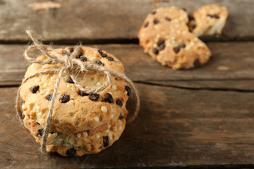 Tasty cookies on rustic wooden background