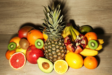 Fototapeta na wymiar Assortment of exotic fruits on wooden background